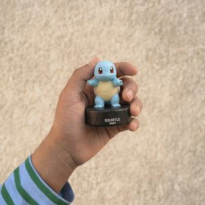 A kid is holding the Tonies Pokemon Squirtle