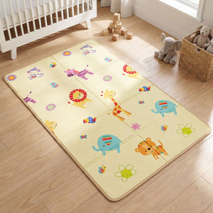 The bright, animal-themed side of the Allis 176x96cm Folding Play Mat placed neatly next to a white baby cot in a nursery.