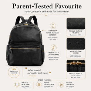 A black backpack with gold zipper pulls and hardware, shown on a light beige infographic background with text callouts about its features, including parent-tested favorite, easy-clean water-resistant exterior, smooth gold zipper hardware, and quality zip pulls.