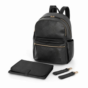 A black leather backpack with gold-tone zippers, shown with a matching black foldable changing mat and two detachable shoulder straps on a white background.