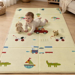 A baby crawling comfortably on the interactive vehicle and town side of the Allis Double Sided Folding Play Mat indoors.