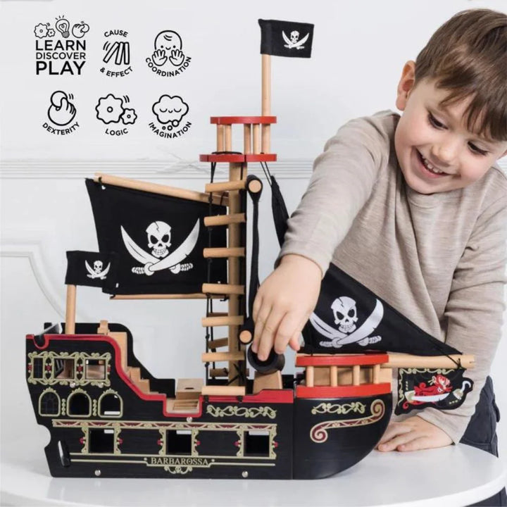 Boy Playing with Wooden Pirate Ship Toy Barbarossa Le Toy Van