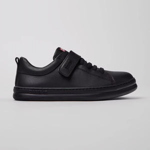 Side view of trendy black kids' camper sneakers