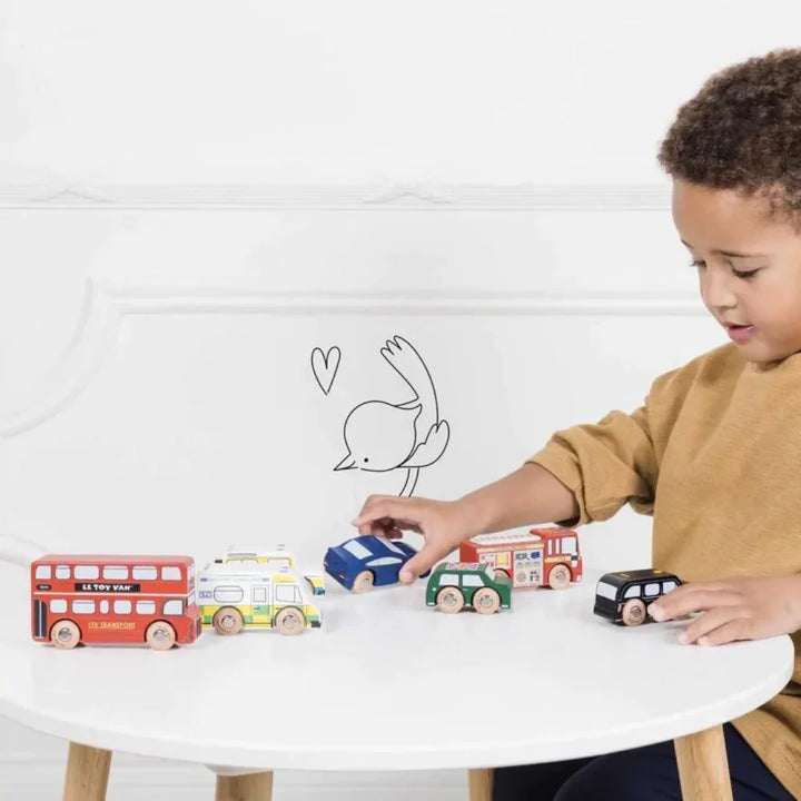 Boy Playing with the 7 Piece Wooden Toy Car Set Le Toy Van