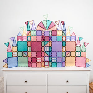 Magnetic tiles forming bridges, castles, and towers