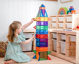 Kids creating castles and rockets with Connetix magnetic tiles