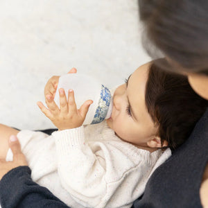 Baby enjoying comfortable feeding with breast-like silicone bottle