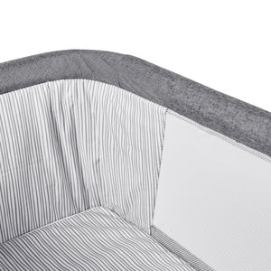 Ickle Bubba rocking crib in rocking mode with soft mattress.