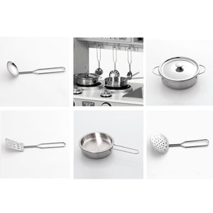 Included play kitchen accessories including stainless steel pots, pans, lids, ladle, and spatulas.