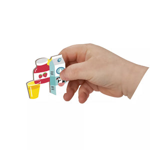 Child’s hand placing magnetic time piece onto Janod Magnetibook play surface