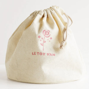 Le Tot Van kids makeup bag with wooden pieces.