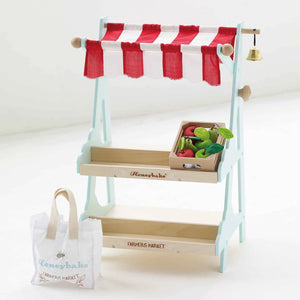 Le Toy Van wooden market stall with a shopping bag.