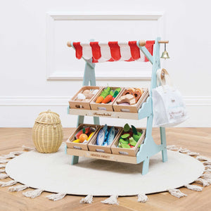 Lifestyle image of the Le toy van wooden market stall.