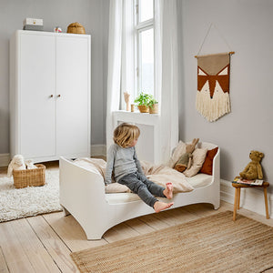 Growing child using adapted Leander junior bed.