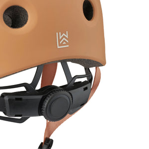 Side view showing adjustable webbing straps and buckle closure