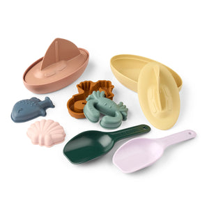 Liewood table accessories such as boat, crab, fish, shovel.