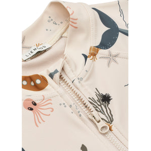 Close view of liewood swim jumpsuit - sea creature, sandy.