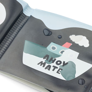 Close-up of water changing the page colors.