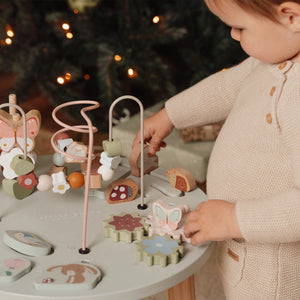 Kids playing with animal on activity table