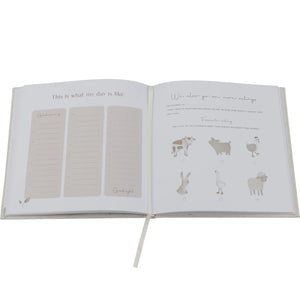 Light beige linen cover of Little Dutch Baby Book 'My First Year' with Baby Bunny illustration.