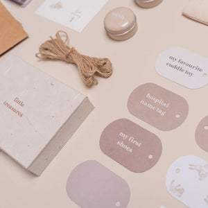 memory box accessories: booklet, tags, jute string, envelopes, and photo corners displayed.