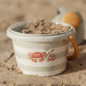 Close-up of green bucket and tools from Little Dutch 5 piece set.