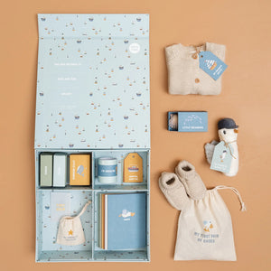 Memory box with cards, labels, and small containers arranged neatly.