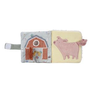 Soft stroller booklet for baby with hidden toy.
