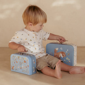 A toddler is carrying a Little Dutch suitcase set - Forest Friends