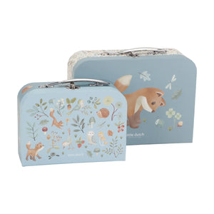Two blue children's suitcases with a forest friends theme, including a fox design and various forest animals illustrated on them.