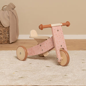 First ride-on tricycle supporting balance and coordination.