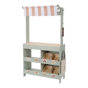 Children's toy storage unit with shelves and bins on a white background