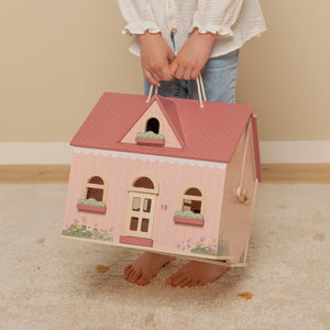 Portable dollhouse design perfect for play at home or on the go.