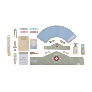 Band-aids and pretend medical tools in a white background.