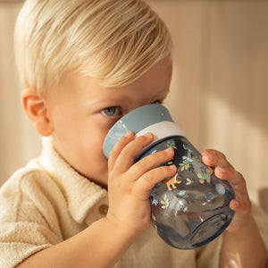 A young boy drinking independently from the Little Dutch 360-degree Forest Friends cup, demonstrating the easy-sip edge.