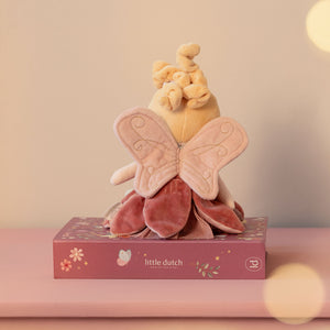 Whimsical fabric wings attached to the back of the doll for a magical look.