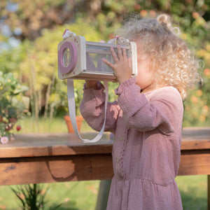Kids using magnifying glass to view insects closely with the little dutch insects box.