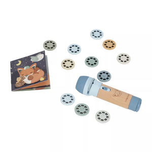Little Dutch wooden torch with a light blue head and a natural wood handle, shown with multiple circular dial pieces and a small illustrated booklet on a white background.