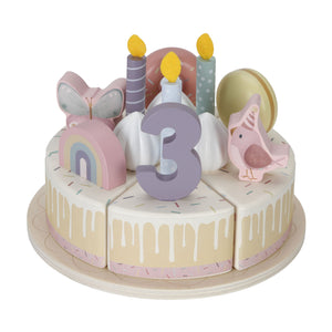 Pink version of the Little Dutch wooden birthday cake on a white background, decorated with a number 3 topper, macaron, rainbow, and animal figures.