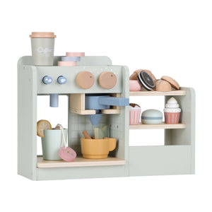 The Little Dutch Coffee Corner wooden toy set on a white background, featuring a mint green coffee machine with dials, alongside a display shelf stocked with toy cups and pastries.