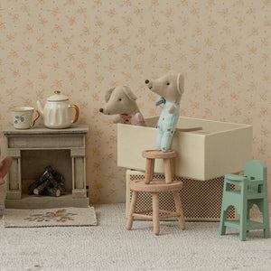 Maileg Mice in a matchbox with vintage-style accessories.