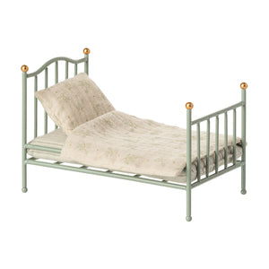 Maileg vintage metal single bed in mint green with printed bedding.