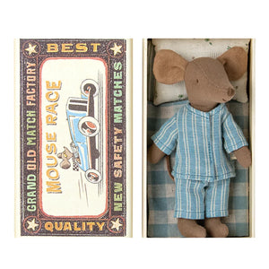 An image showing a toy mouse in a matchbox. The matchbox is designed to look like a vintage best quality award certificate with illustrations of mice and text.