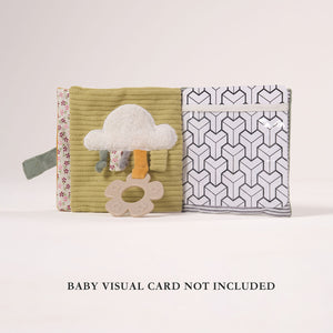 Open MiniDream soft baby book showing a fluffy cloud design and a see-through clear pocket for interactive play and exploration.