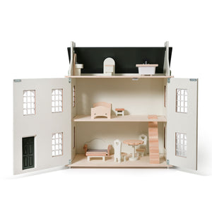 The house is a white and grey wooden dollhouse, featuring three levels, a black roof, and natural wood accents. The house comes with 11 pieces of furniture, including a bed, dining table, chairs, stairs, bathtub, and toilet. The doors open to reveal the interior, and the top level has a roof that opens up for additional play space.