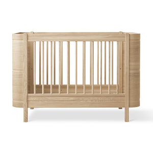 Oliver furniture cozy and durable oak cot bed for newborns and toddlers