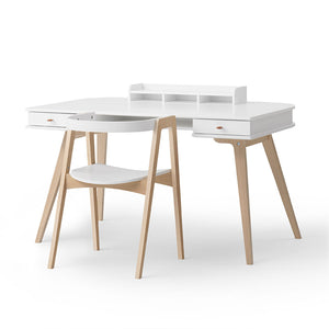 Wooden desk with light oak finish and clean, minimal design.