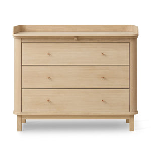 Nursery dresser with changing top and rounded edges.