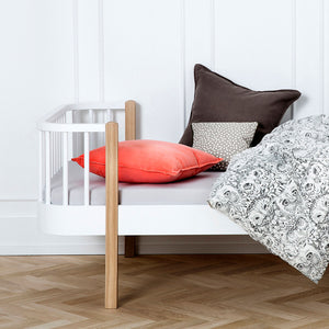 Cozy bedroom setup with Wood Original bed and bedding.