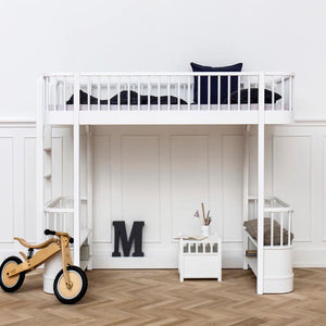 Loft bed with built-in shelves and small seating area underneath
